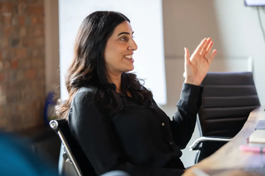 Pavan Sidhu, Operating Partner, leading a discussion with the Acquen team